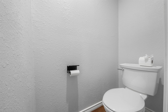 5413 Bataan Rd, Houston, TX 77033 - bathroom featuring toilet and baseboards