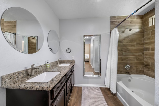 5413 Bataan Rd, Houston, TX 77033 - full bathroom featuring shower / tub combo, double vanity, and wood tiled floors