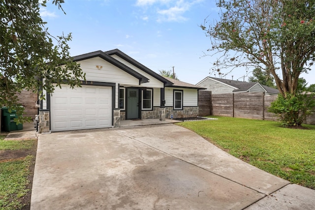 5413 Bataan Rd, Houston, TX 77033 - ranch-style house featuring concrete driveway, an attached garage, and stone siding