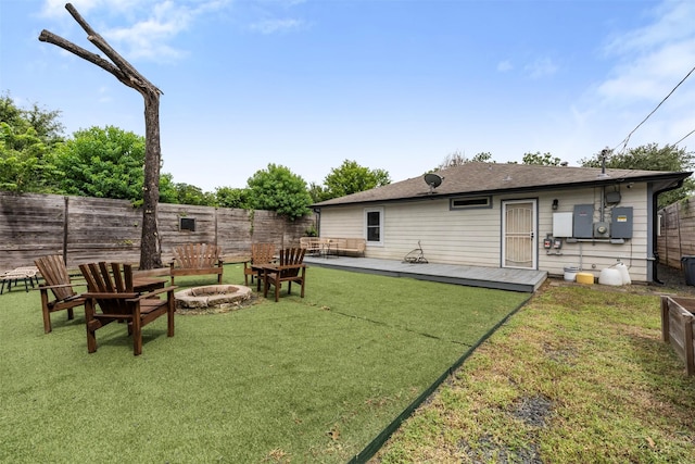 5413 Bataan Rd, Houston, TX 77033 - view of yard with a fire pit and a deck