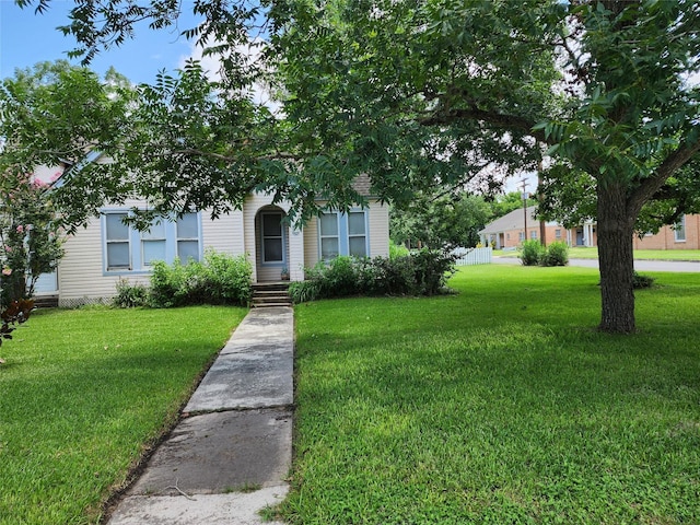 517 Church St, Navasota, TX 77868 - obstructed view of property with a front yard