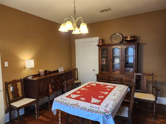 517 Church St, Navasota, TX 77868 - dining area featuring a chandelier and dark wood-type flooring