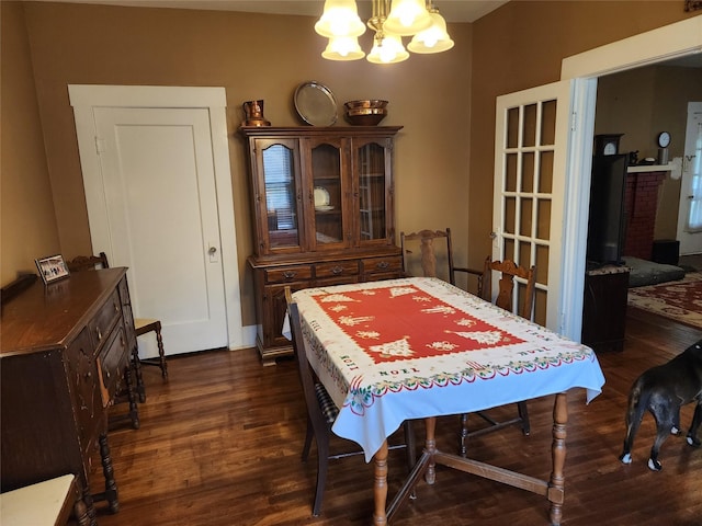 517 Church St, Navasota, TX 77868 - dining room with a chandelier and dark wood finished floors