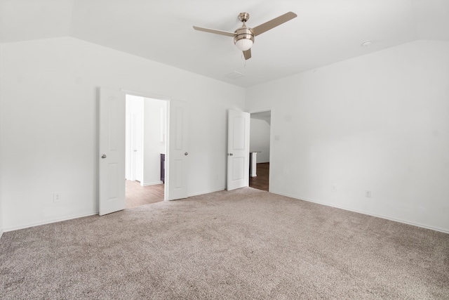 20213 Portbec Dr, New Caney, TX 77357 - unfurnished bedroom with vaulted ceiling, carpet, and a ceiling fan