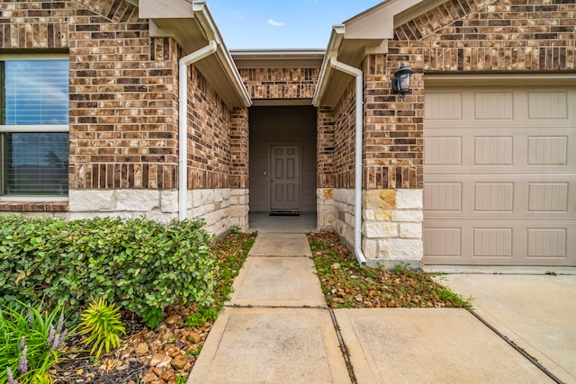 20213 Portbec Dr, New Caney, TX 77357 - doorway to property with brick siding, stone siding, and a garage