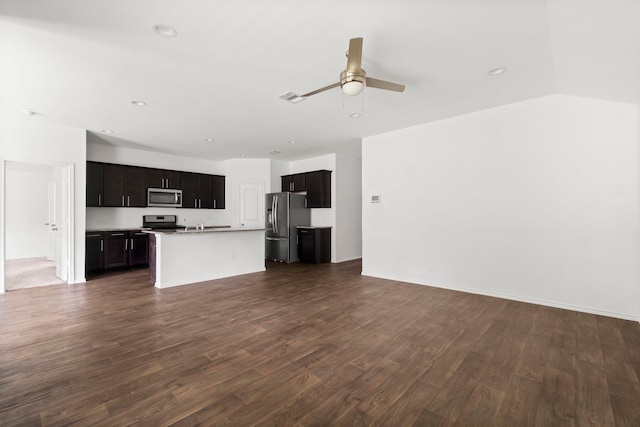 20213 Portbec Dr, New Caney, TX 77357 - unfurnished living room featuring dark wood-style floors, ceiling fan, and recessed lighting