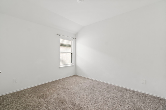 20213 Portbec Dr, New Caney, TX 77357 - empty room featuring vaulted ceiling and carpet flooring