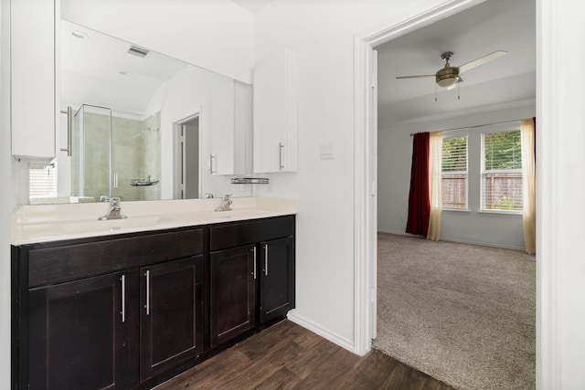 20213 Portbec Dr, New Caney, TX 77357 - bathroom featuring a shower stall, double vanity, a ceiling fan, and wood finished floors