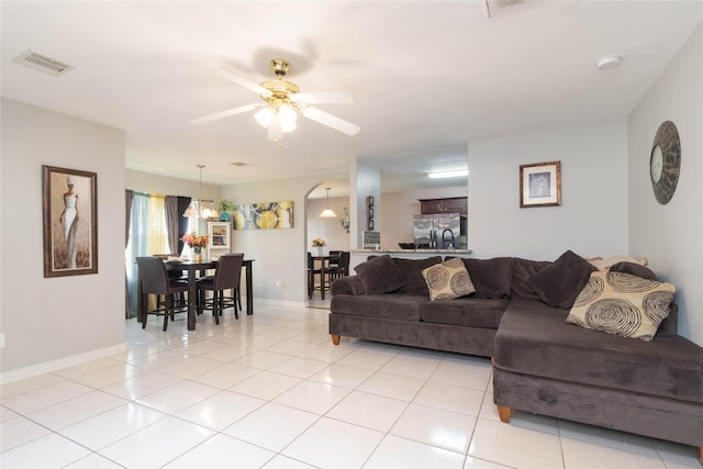 1526 Daffodil Rd, Missouri City, TX 77489 - living room with ceiling fan and light tile patterned floors