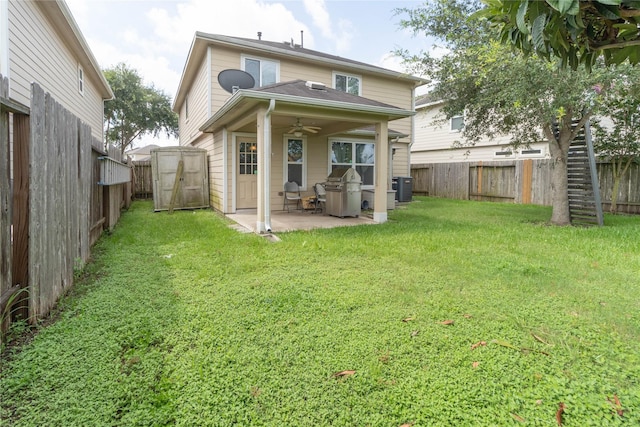 1526 Daffodil Rd, Missouri City, TX 77489 - rear view of property featuring a patio, a fenced backyard, ceiling fan, and a shed