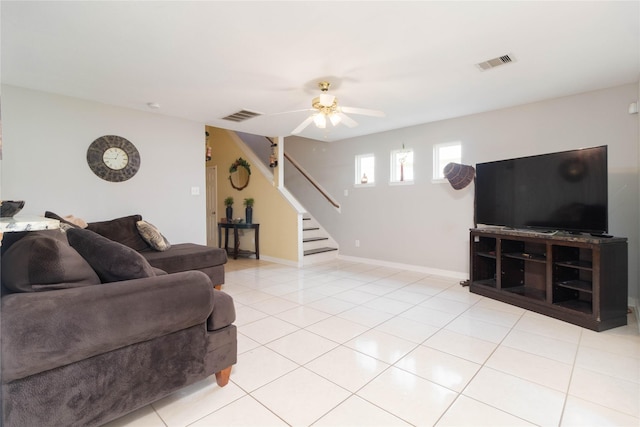 1526 Daffodil Rd, Missouri City, TX 77489 - living room with stairs, ceiling fan, and light tile patterned floors