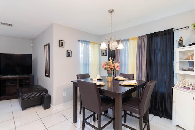 1526 Daffodil Rd, Missouri City, TX 77489 - dining room featuring a chandelier and light tile patterned floors