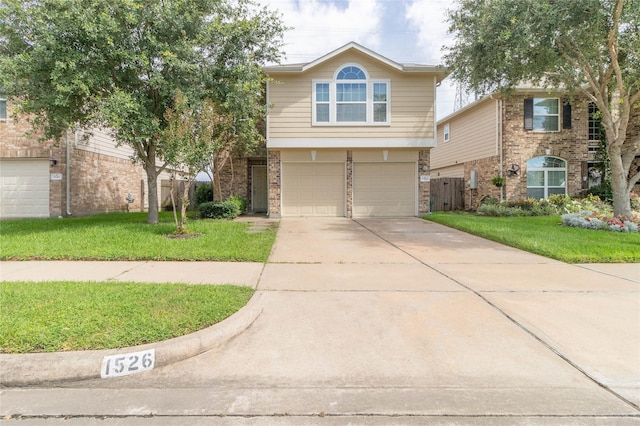 1526 Daffodil Rd, Missouri City, TX 77489 - view of front of property with concrete driveway, brick siding, and an attached garage