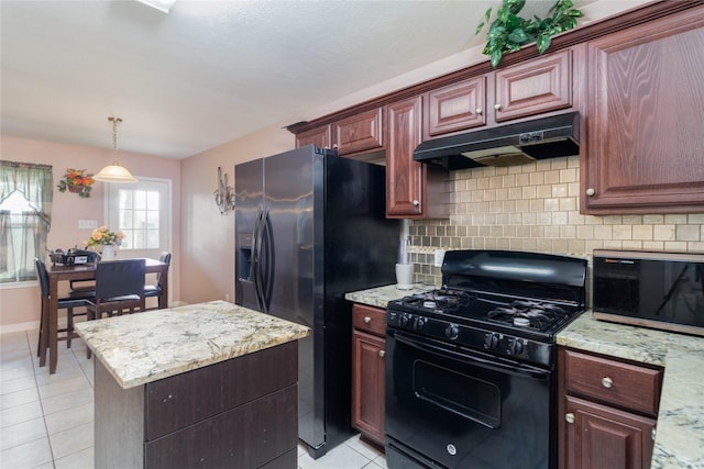 1526 Daffodil Rd, Missouri City, TX 77489 - kitchen featuring gas stove, under cabinet range hood, light tile patterned flooring, tasteful backsplash, and refrigerator with ice dispenser