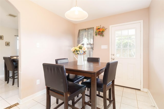 1526 Daffodil Rd, Missouri City, TX 77489 - dining area featuring light tile patterned floors and arched walkways