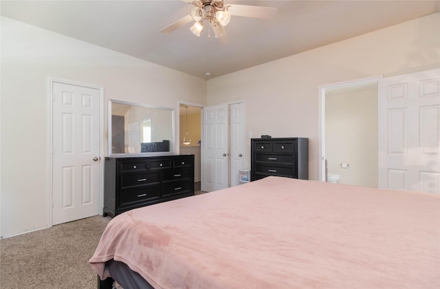 1526 Daffodil Rd, Missouri City, TX 77489 - bedroom featuring multiple closets, carpet floors, ensuite bathroom, and ceiling fan