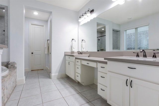 29110 Davenport Dr, Katy, TX 77494 - full bathroom featuring double vanity, a shower with door, a bath, and tile patterned flooring