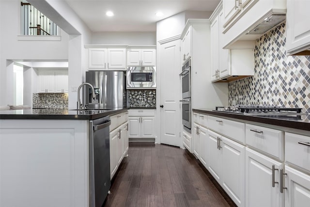 29110 Davenport Dr, Katy, TX 77494 - kitchen featuring stainless steel appliances, tasteful backsplash, dark countertops, and recessed lighting