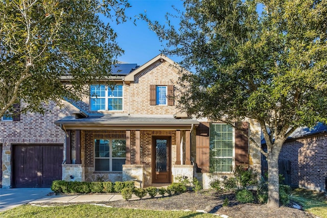 29110 Davenport Dr, Katy, TX 77494 - view of front of property featuring brick siding, solar panels, driveway, and a porch