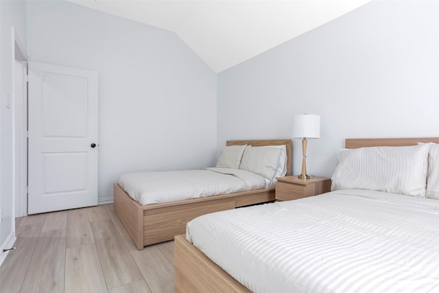 29110 Davenport Dr, Katy, TX 77494 - bedroom featuring lofted ceiling and light wood-type flooring
