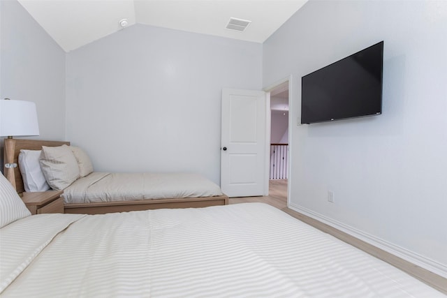 29110 Davenport Dr, Katy, TX 77494 - bedroom featuring wood finished floors and lofted ceiling