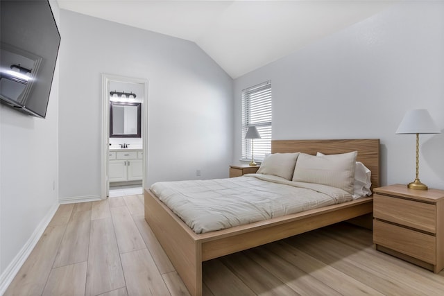 29110 Davenport Dr, Katy, TX 77494 - bedroom featuring light wood-style flooring, vaulted ceiling, and ensuite bathroom