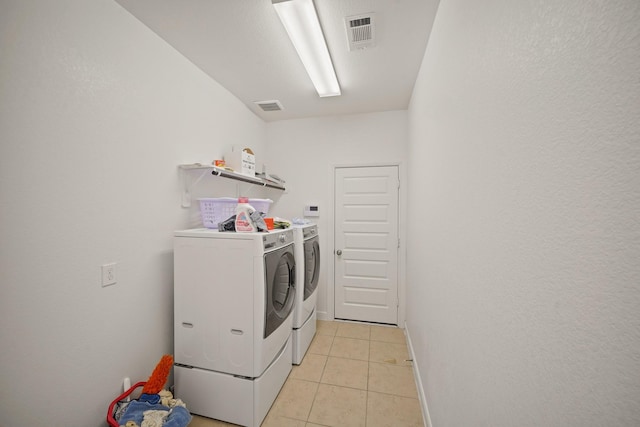 5706 Jenolan Ridge Ln, Sugar Land, TX 77479 - washroom featuring independent washer and dryer and light tile patterned floors