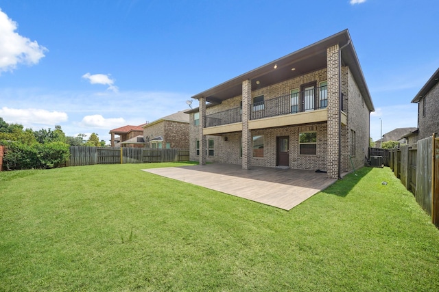 5706 Jenolan Ridge Ln, Sugar Land, TX 77479 - back of house featuring a balcony, a fenced backyard, a patio area, and brick siding