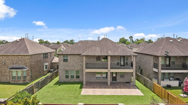 5706 Jenolan Ridge Ln, Sugar Land, TX 77479 - rear view of property with a balcony, a patio area, a fenced backyard, brick siding, and a residential view