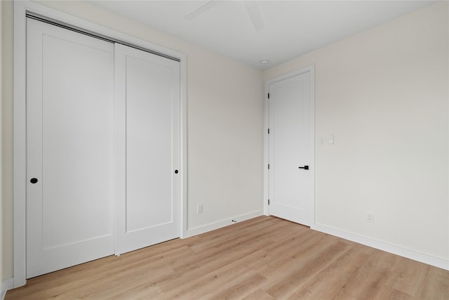 8022 Colonial Ln, Houston, TX 77051 - unfurnished bedroom featuring light wood finished floors, a closet, and a ceiling fan