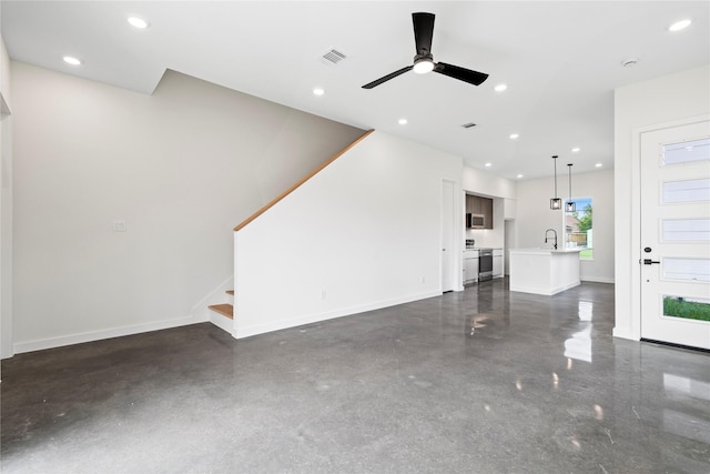 8022 Colonial Ln, Houston, TX 77051 - unfurnished living room with ceiling fan, stairway, and recessed lighting