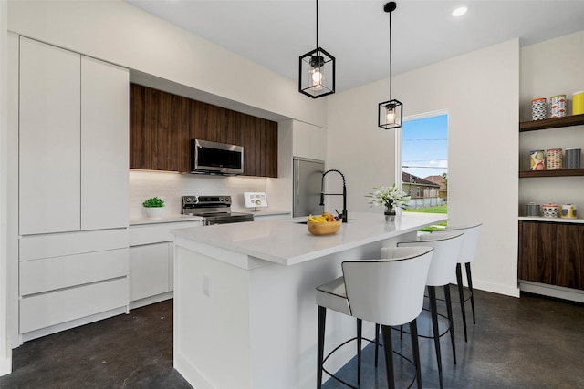 8022 Colonial Ln, Houston, TX 77051 - kitchen with stainless steel appliances, finished concrete floors, modern cabinets, light countertops, and white cabinetry