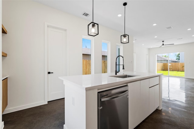 8022 Colonial Ln, Houston, TX 77051 - kitchen with stainless steel dishwasher, concrete flooring, white cabinets, pendant lighting, and recessed lighting