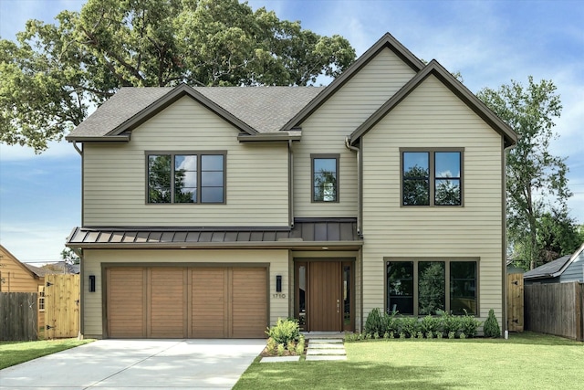 1710 Ebony Ln, Houston, TX 77018 - view of front facade with a standing seam roof, driveway, a garage, and roof with shingles