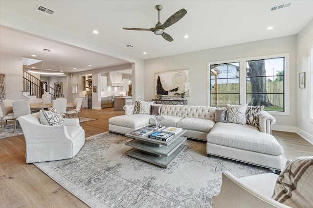 1710 Ebony Ln, Houston, TX 77018 - living room with stairway, wood finished floors, ceiling fan, and recessed lighting
