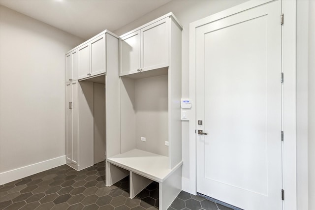 1710 Ebony Ln, Houston, TX 77018 - mudroom with baseboards and dark tile patterned floors