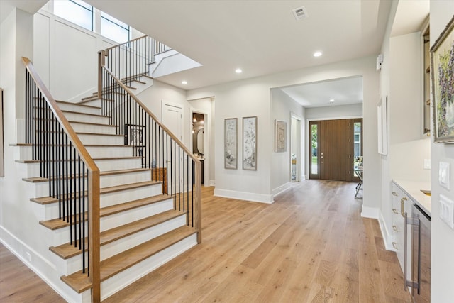 1710 Ebony Ln, Houston, TX 77018 - entrance foyer featuring stairs, light wood finished floors, and recessed lighting