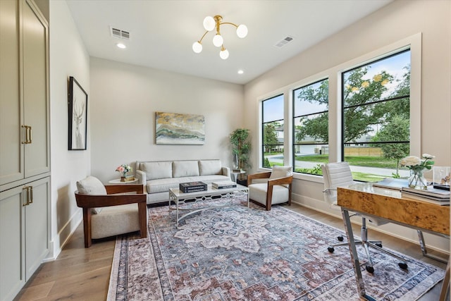 1710 Ebony Ln, Houston, TX 77018 - living room with light wood finished floors, a desk, and recessed lighting