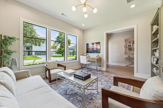 1710 Ebony Ln, Houston, TX 77018 - living area featuring wood finished floors, an office area, a chandelier, and recessed lighting