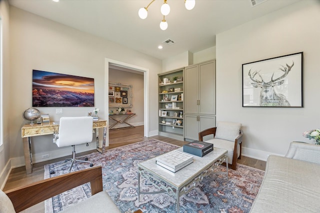 1710 Ebony Ln, Houston, TX 77018 - living room featuring wood finished floors, a chandelier, built in features, and recessed lighting