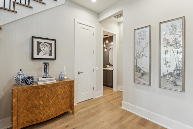 1710 Ebony Ln, Houston, TX 77018 - hallway featuring light wood finished floors and recessed lighting