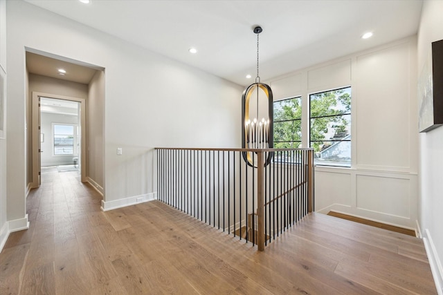 1710 Ebony Ln, Houston, TX 77018 - hall with wood finished floors, recessed lighting, and an upstairs landing