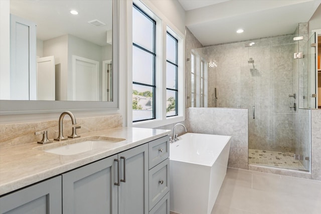 1710 Ebony Ln, Houston, TX 77018 - full bath with a soaking tub, healthy amount of natural light, vanity, a shower stall, and recessed lighting