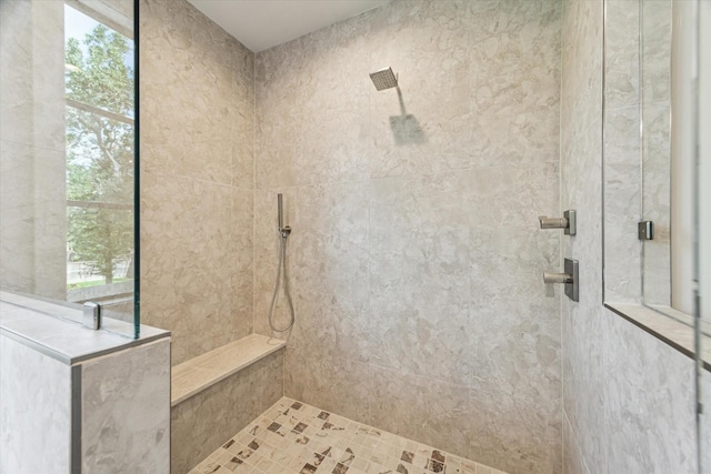 1710 Ebony Ln, Houston, TX 77018 - bathroom featuring tiled shower and plenty of natural light