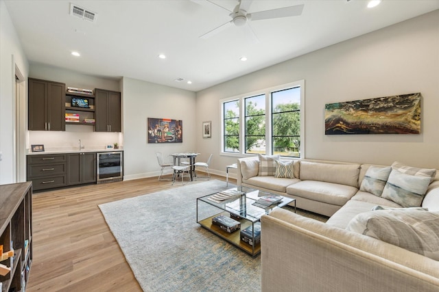 1710 Ebony Ln, Houston, TX 77018 - living area with beverage cooler, wet bar, ceiling fan, recessed lighting, and light wood-style floors