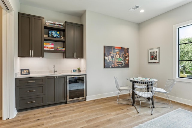 1710 Ebony Ln, Houston, TX 77018 - indoor wet bar featuring wine cooler, light wood-style floors, and recessed lighting