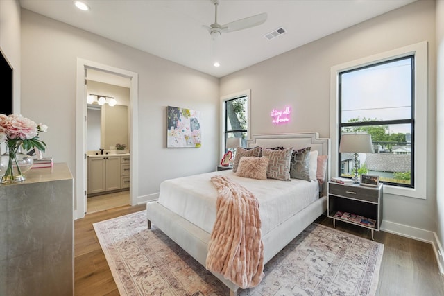 1710 Ebony Ln, Houston, TX 77018 - bedroom with wood finished floors, recessed lighting, connected bathroom, and ceiling fan