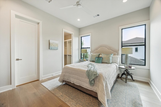 1710 Ebony Ln, Houston, TX 77018 - bedroom with wood finished floors, a walk in closet, recessed lighting, and a ceiling fan