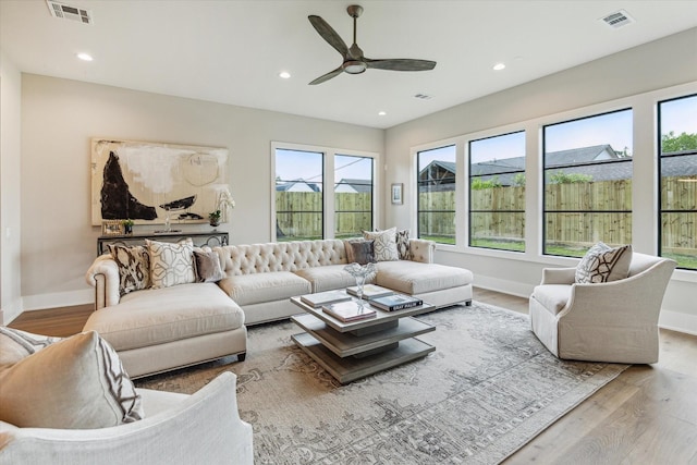 1710 Ebony Ln, Houston, TX 77018 - living area featuring wood finished floors, plenty of natural light, ceiling fan, and recessed lighting