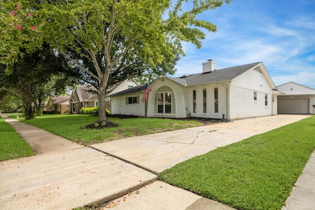 9711 Braewick Dr, Houston, TX 77096 - single story home featuring brick siding, driveway, a chimney, a front lawn, and a garage